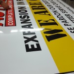 Applying the printed vinly to the sign